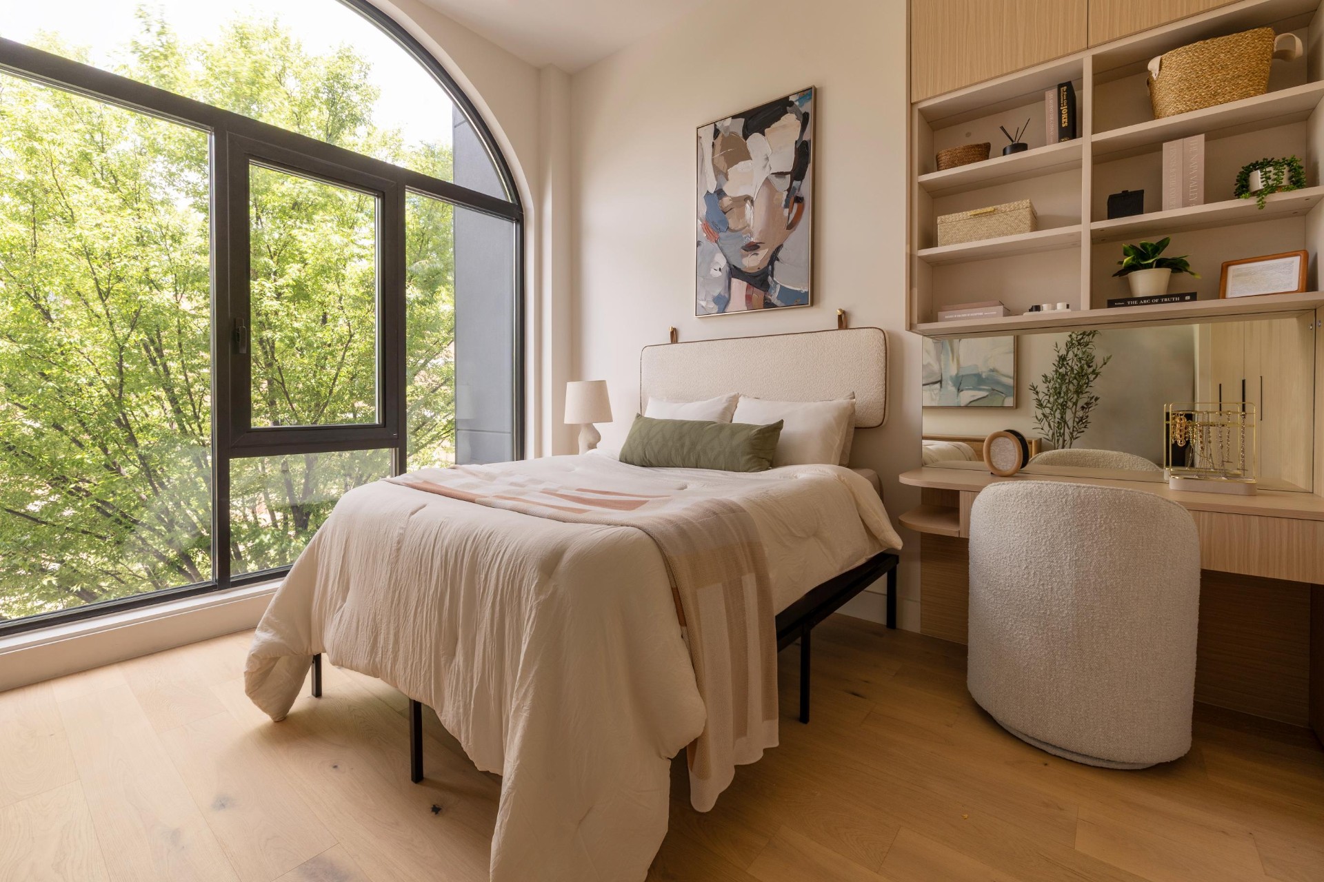 Sunlit bedroom with arched window