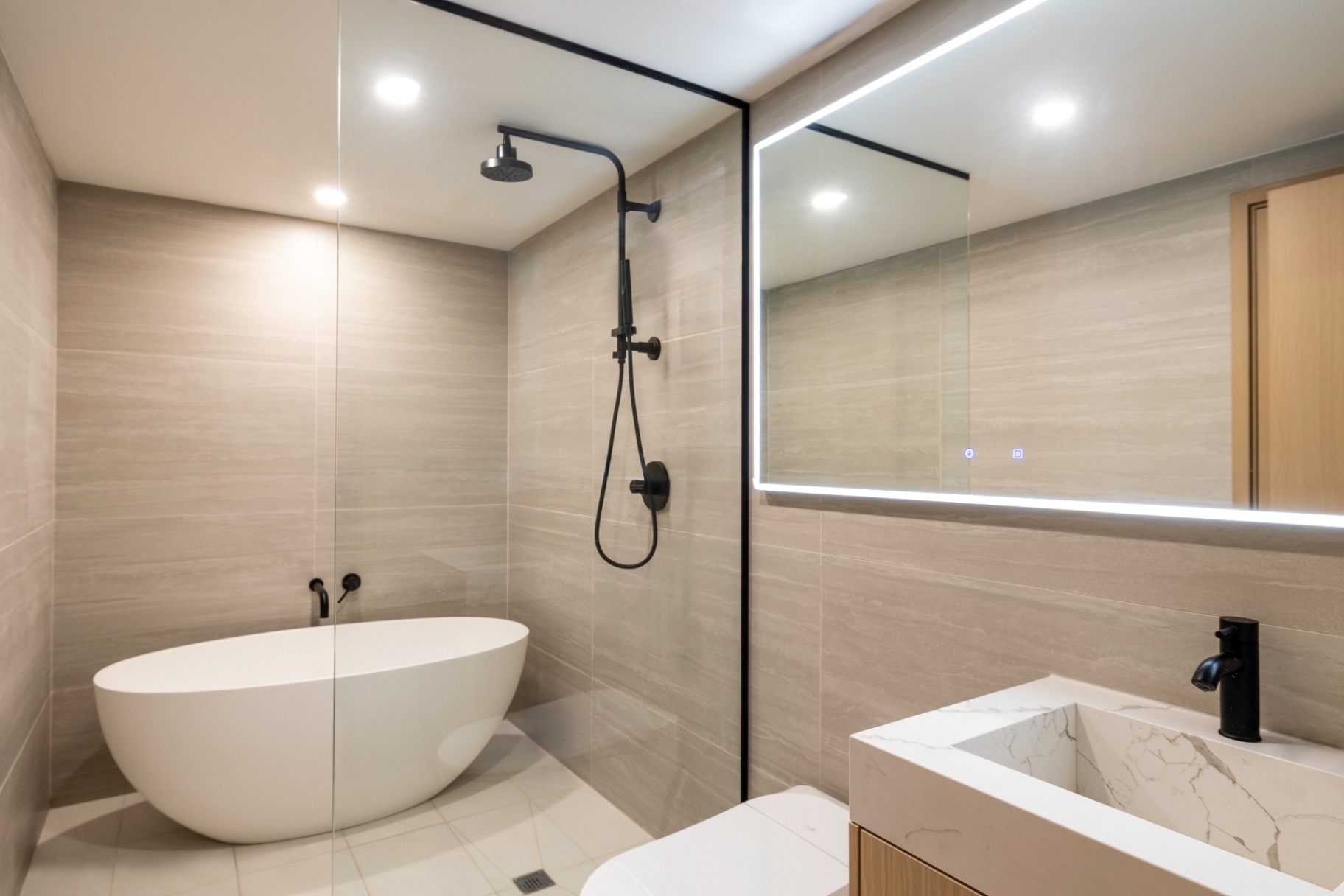Residence 1B bathroom with freestanding soaking tub
