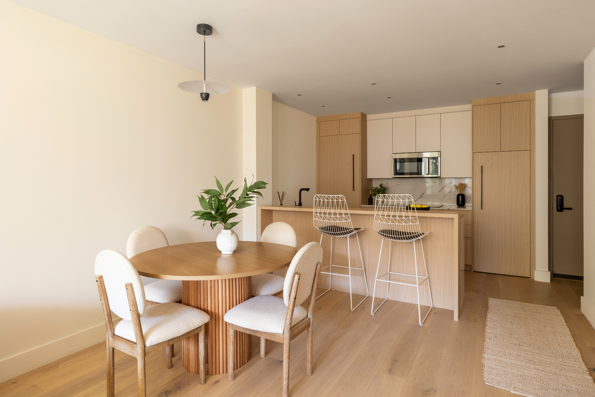 Residence 2B dining area open to the kitchen