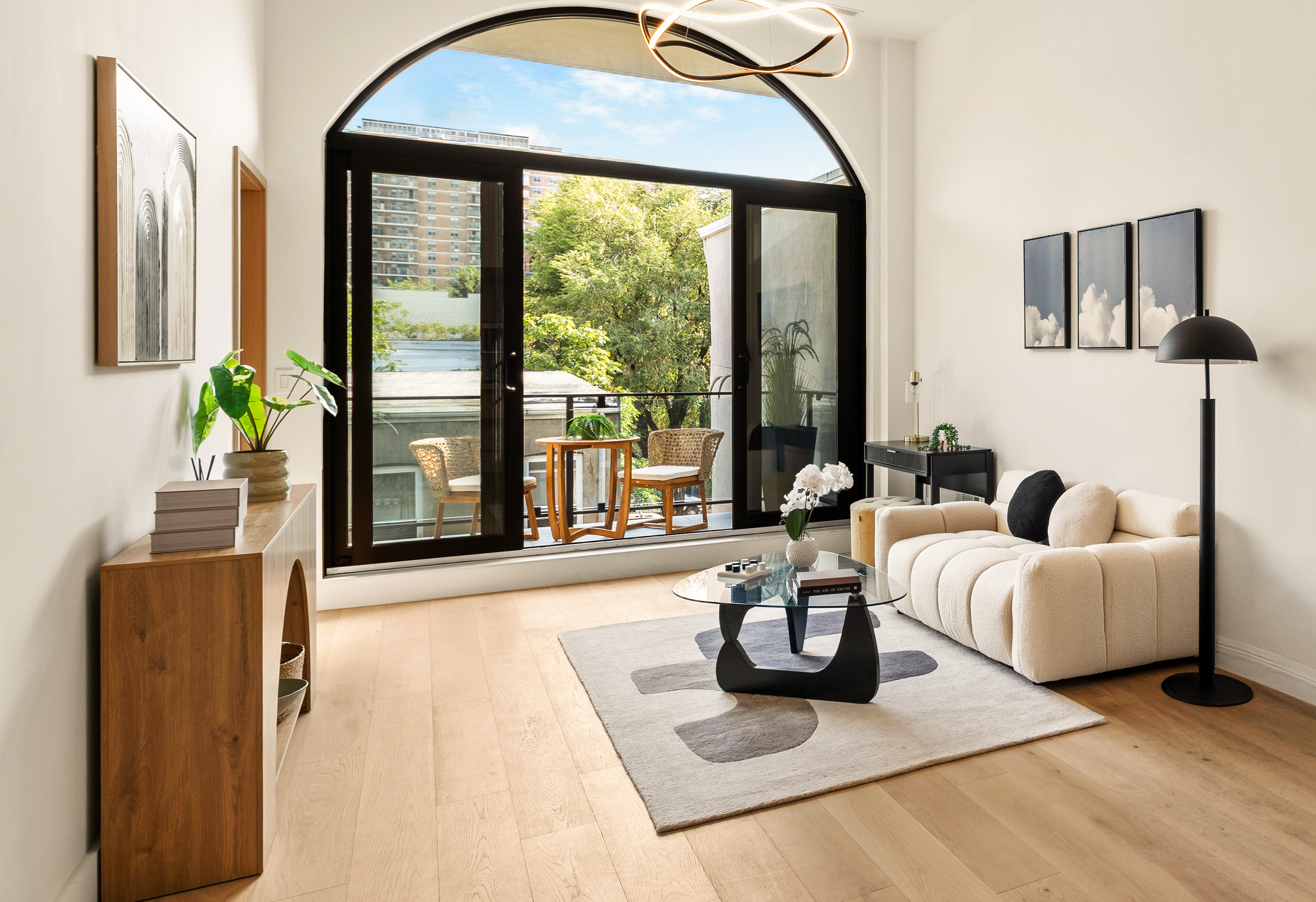 Residence 3B living room with arched balcony doors