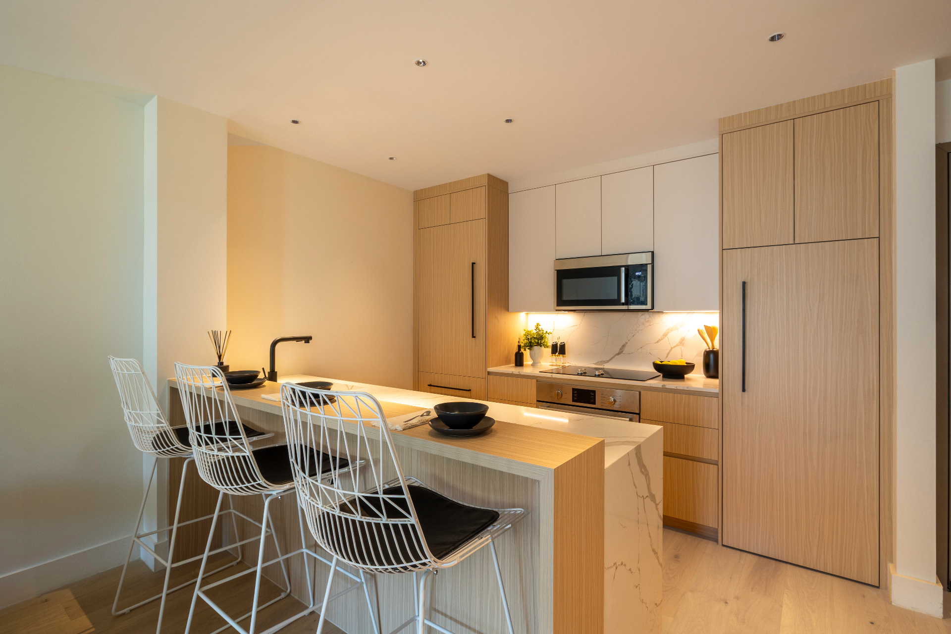 Residence 2B kitchen with vein-matched quartz island
